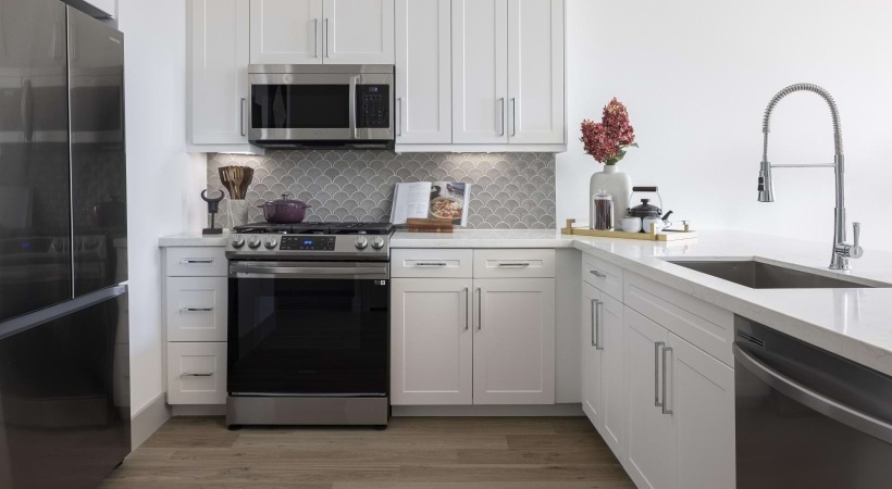 a kitchen with white cabinets