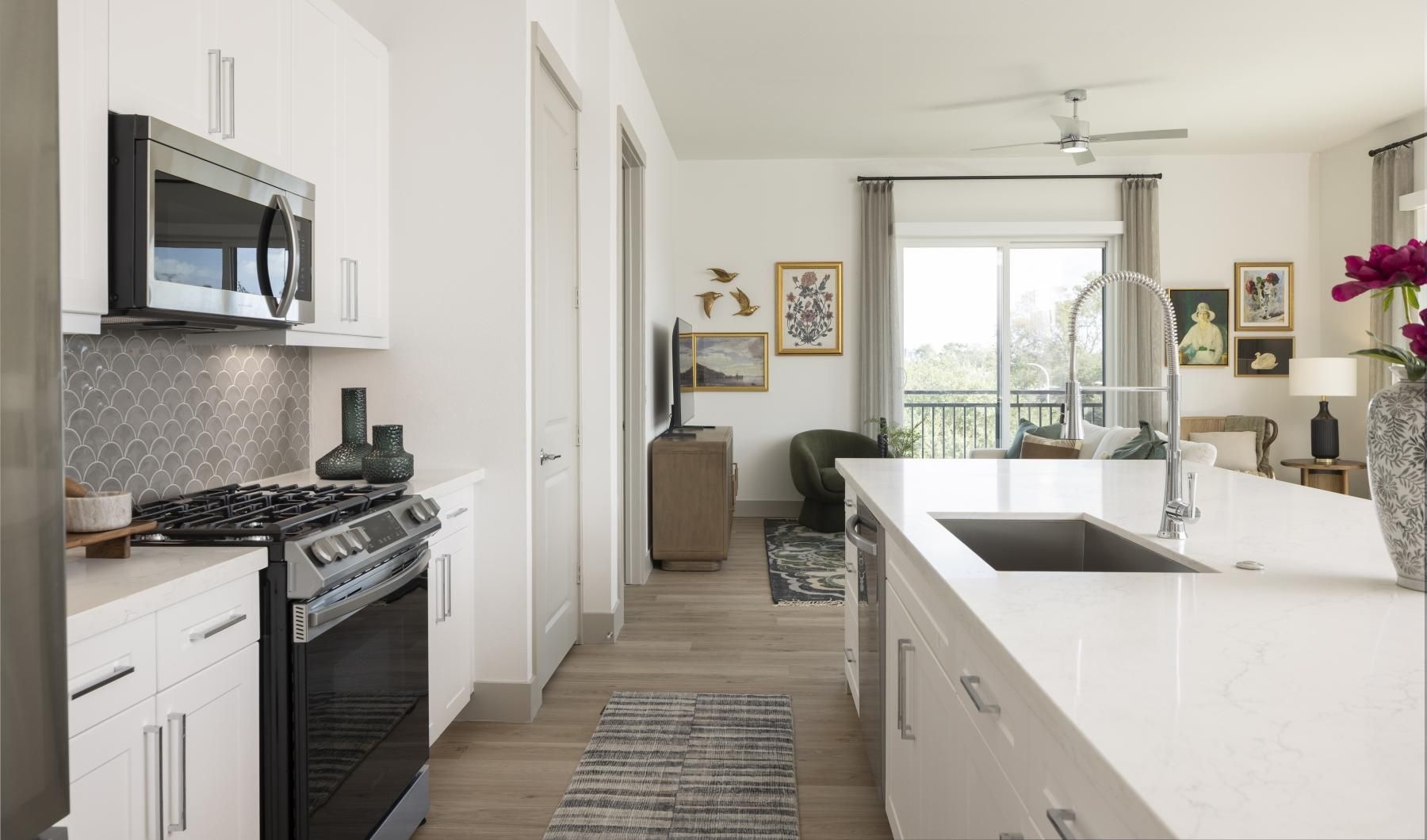 a kitchen with white cabinets
