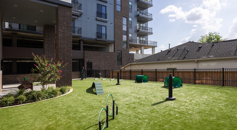 Apartment community dog park with secure fencing