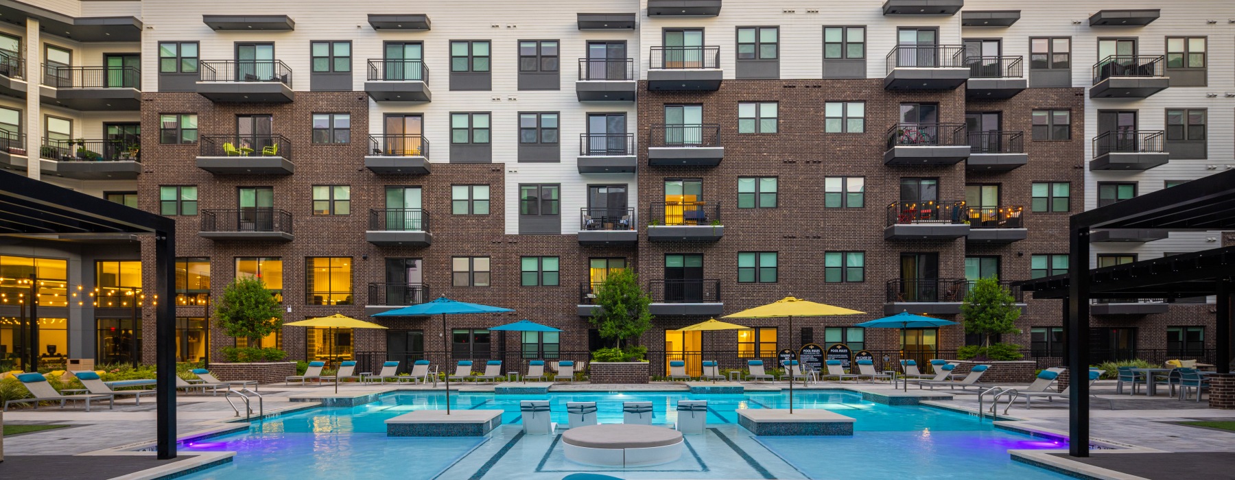 a pool in a courtyard between buildings