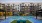 a pool in a courtyard between buildings