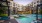 a pool in a courtyard between buildings
