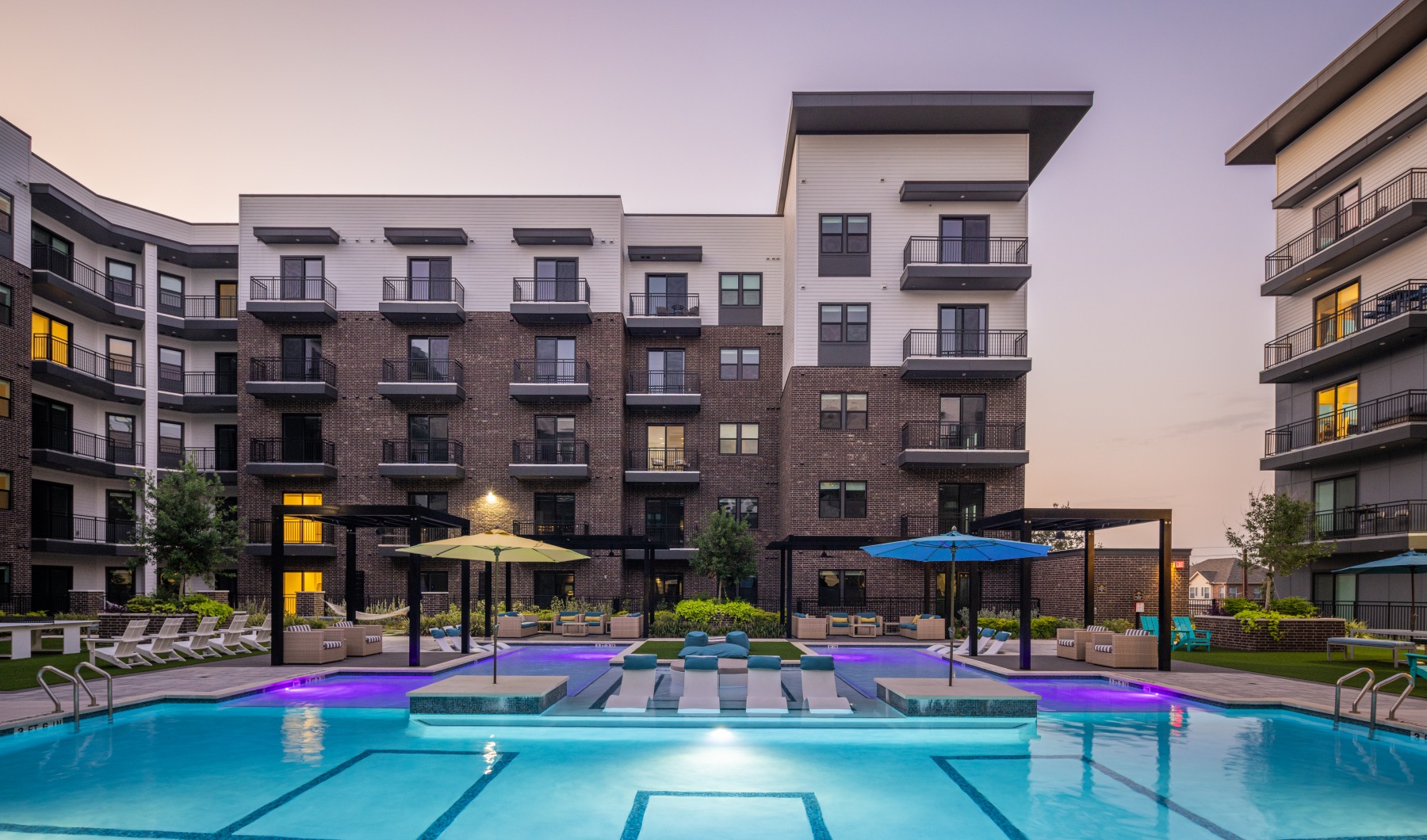 a pool in a courtyard between buildings