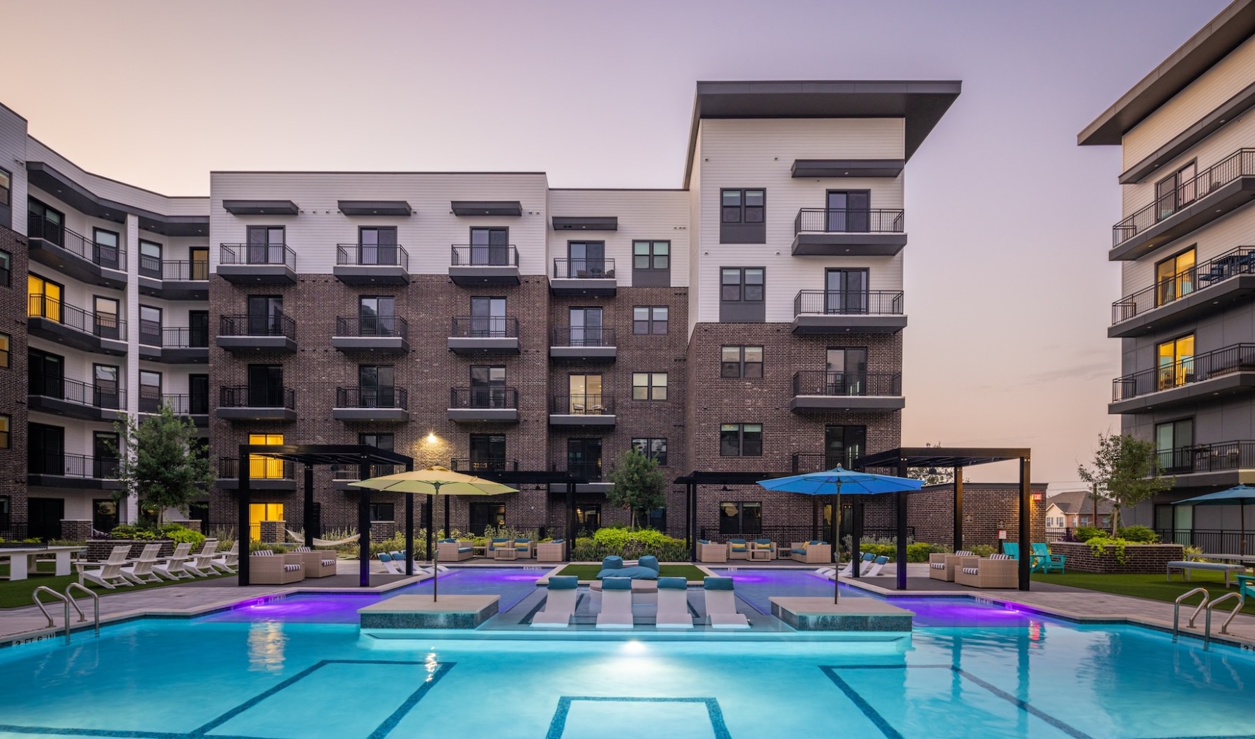 a pool in a courtyard between buildings