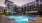 a pool in a courtyard between buildings