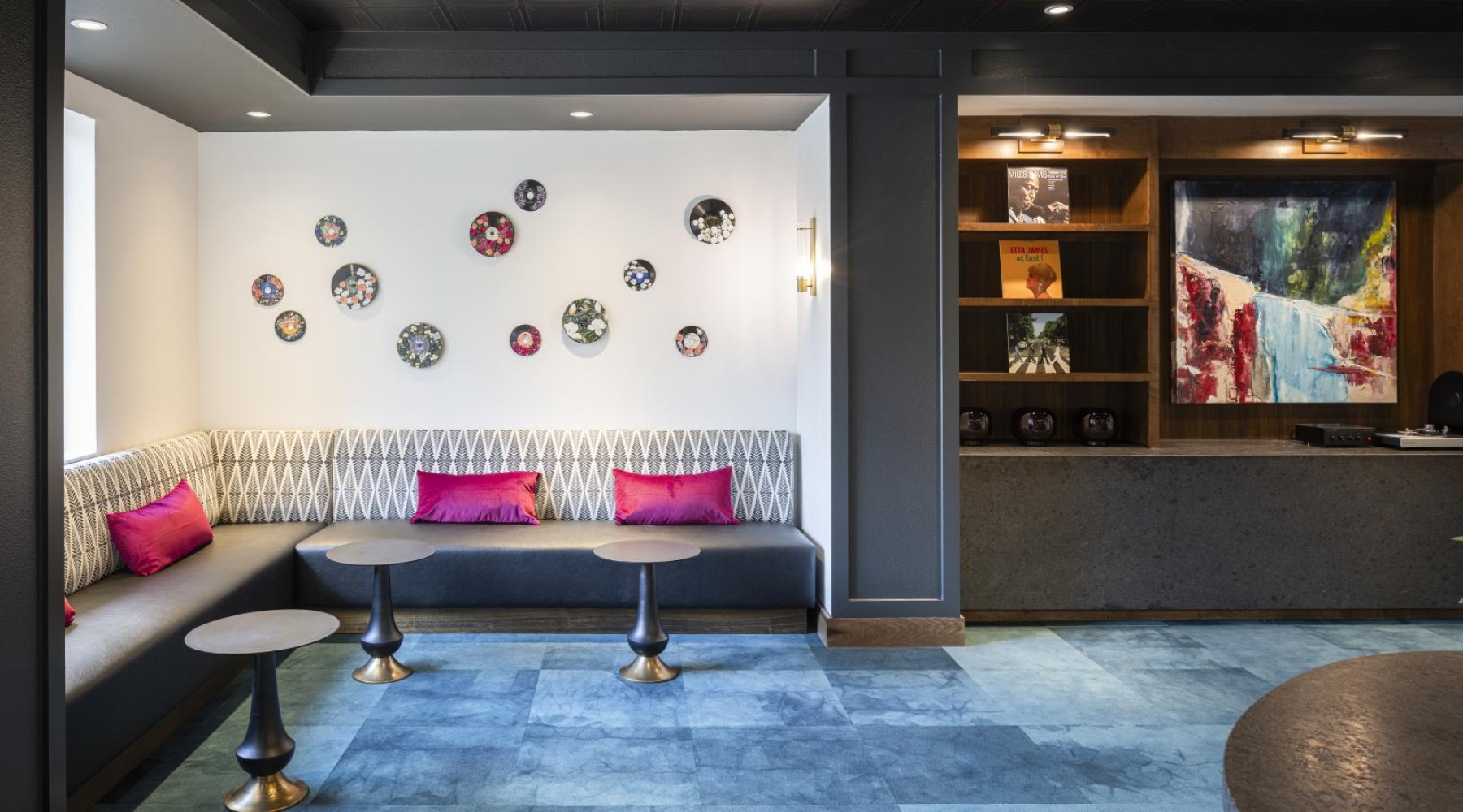 Your curated address lounge area with seating and tables