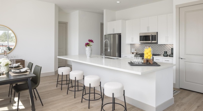 a kitchen with white cabinets