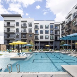pool area showing reclining seating, wooden coverings and ample space