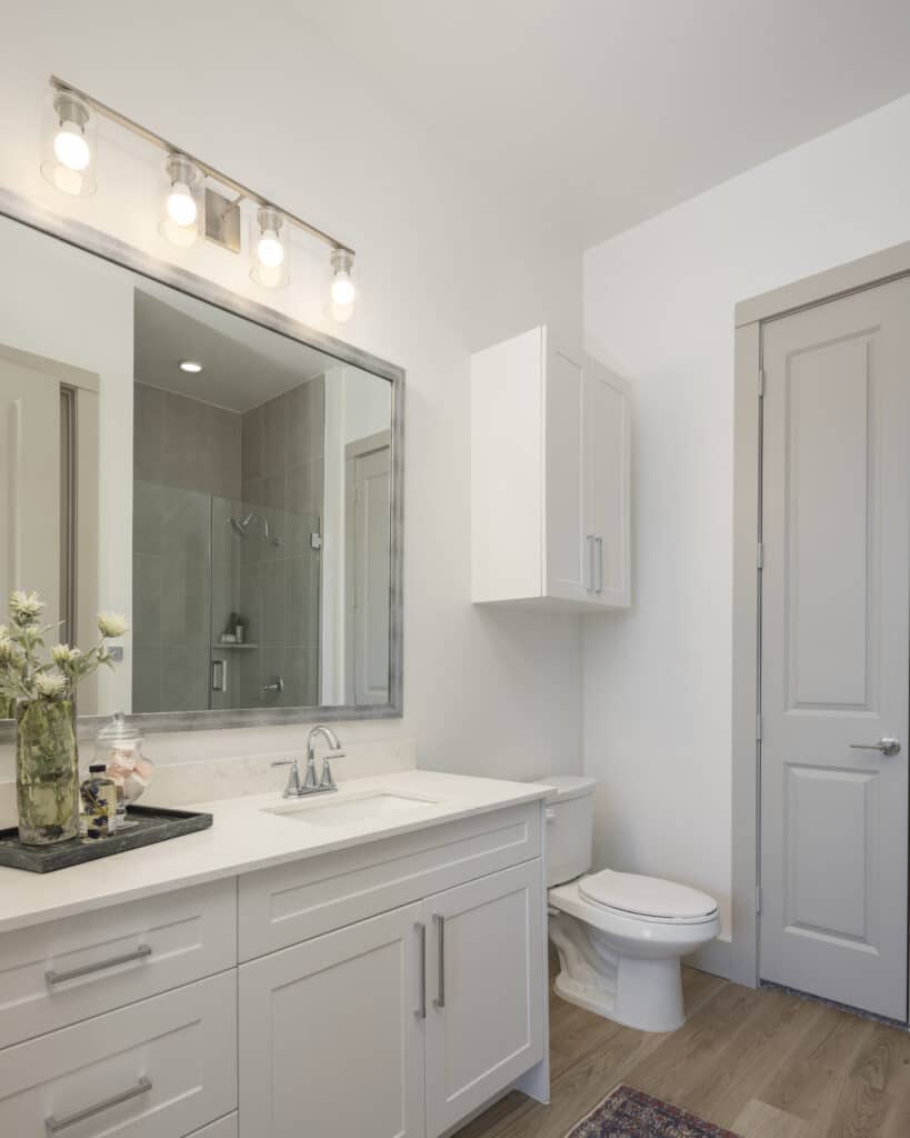 Bathroom with white counters at Broadstone Emeline Heights in Houston, TX